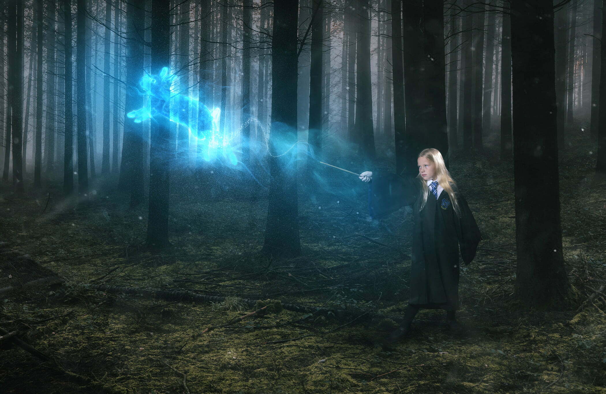 Girl posing as a Harry Potter character in a studio pretending to cast a patronus spell in a forest using digital compositing